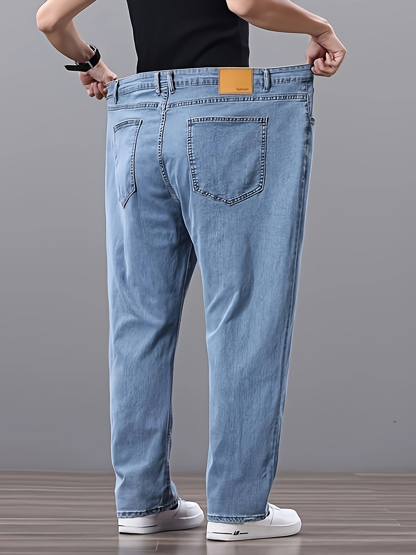 Men's high-waisted denim jeans with stretch fit in a solid color. Features regular fit, straight leg, and made of 45% cotton, 33% polyester, 1.5% spandex, 20.5% rayon. Lightweight at