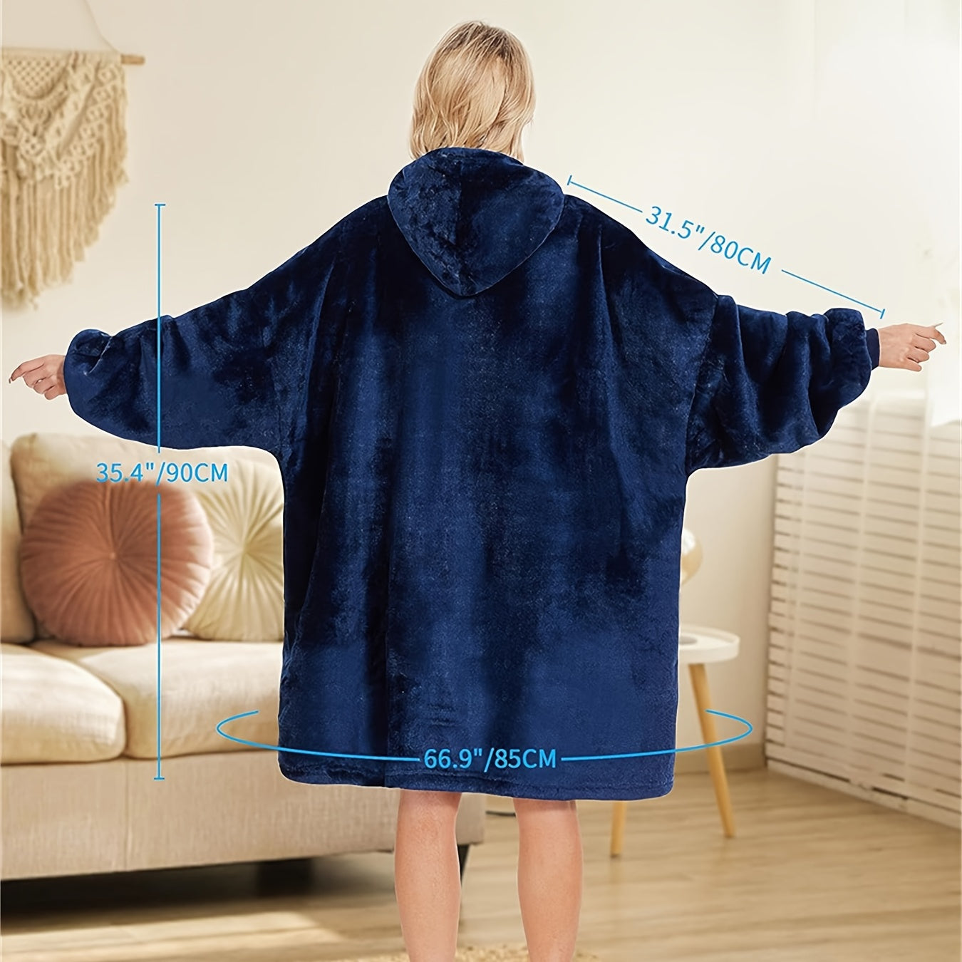 One piece of an oversized hooded blanket made from super soft flannel fabric. This wearable blanket features a stylish hood and a convenient pocket, providing warmth and comfort in cold weather.