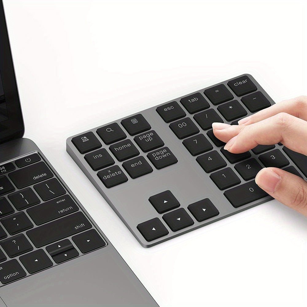 Portable rechargeable wireless digital keyboard with USB charging, 110mAh battery, Type-C charging. Compact design for laptops and mobile devices, black keys, durable keycap material.