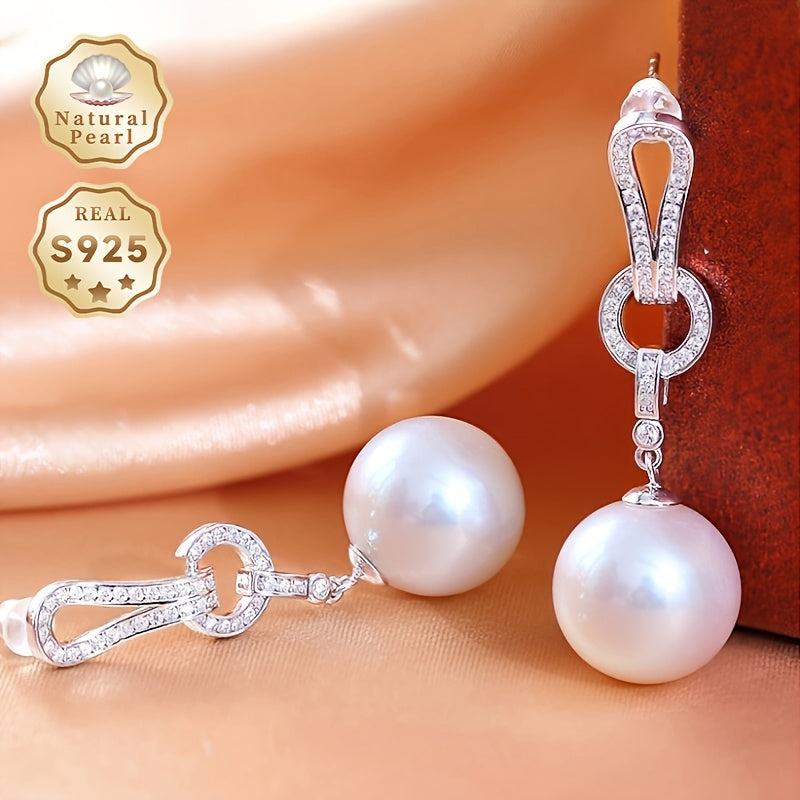 Add a touch of elegance to your collection with these must-have Pearl Dangling Earrings. Crafted with 13-14mm round natural freshwater pearls, these fashionable long earrings are made of S925 silver. Each pair is unique and features varying shapes and