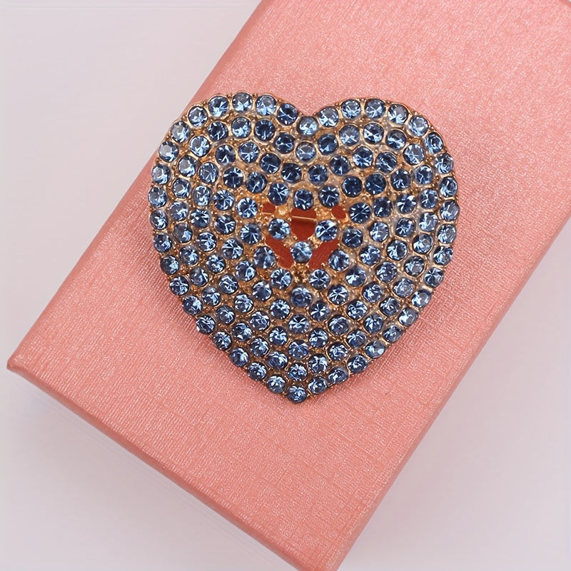 Heart-shaped brooch embellished with sparkling rhinestones - a stylish lapel pin for women's attire, perfect for adding charm to dresses, coats, sweaters, and corsages.