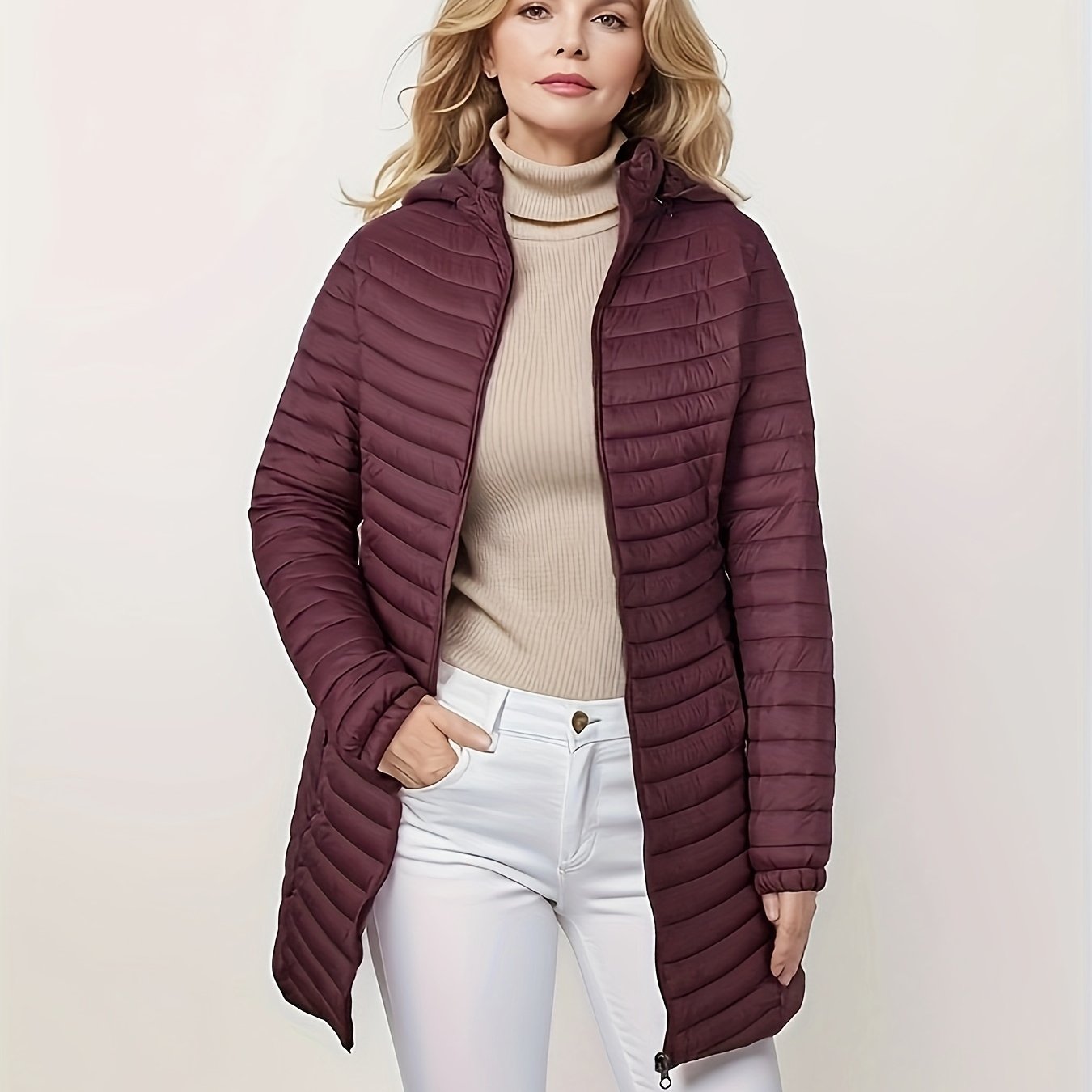 Women's lightweight puffer coat with detachable hood, perfect for winter comfort.