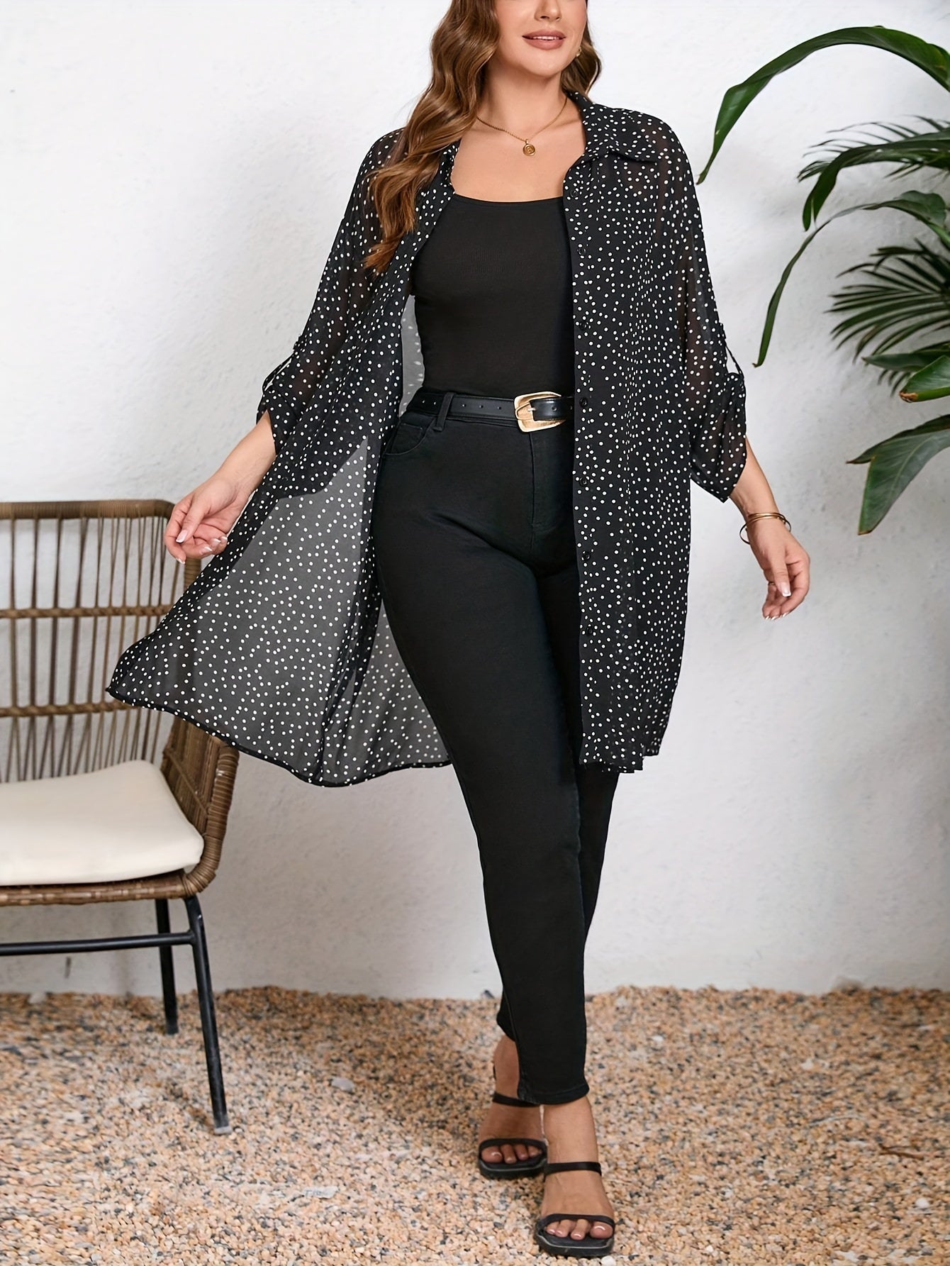 Stylish plus size polka dot blouse with cuffed sleeves. Casual and versatile for all seasons.