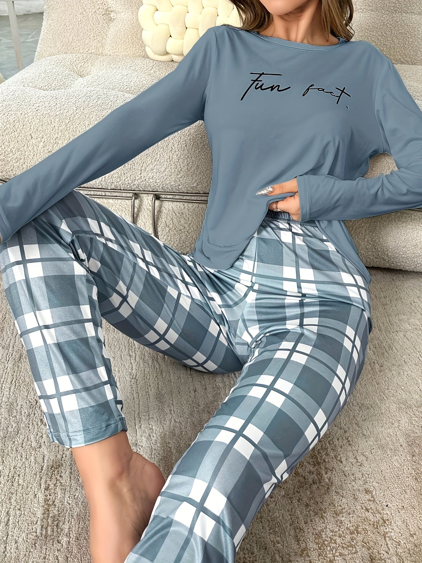 Women's casual sleepwear set includes a gray-blue slogan print long-sleeve top and plaid trousers.