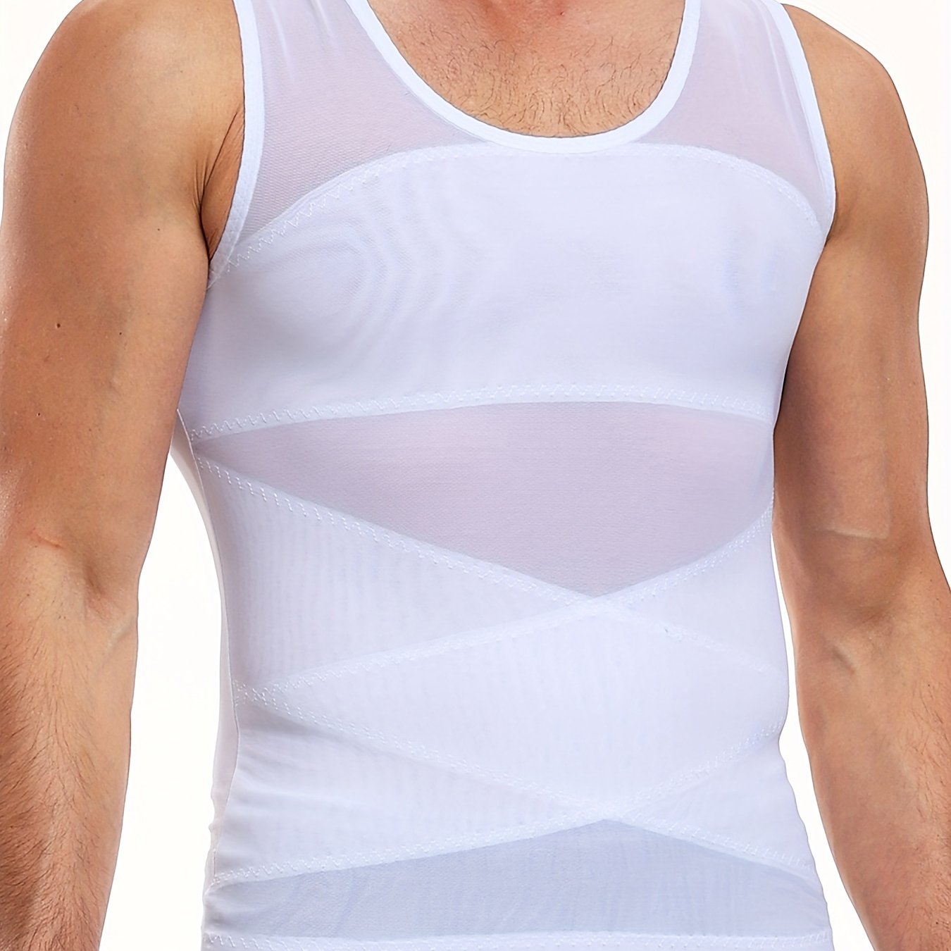 Slimming compression shirt for men with invisible tummy control. Made with a breathable mesh and ribbed nylon-spandex blend. Sleeveless design and crew neck for all-day wear. Slimming