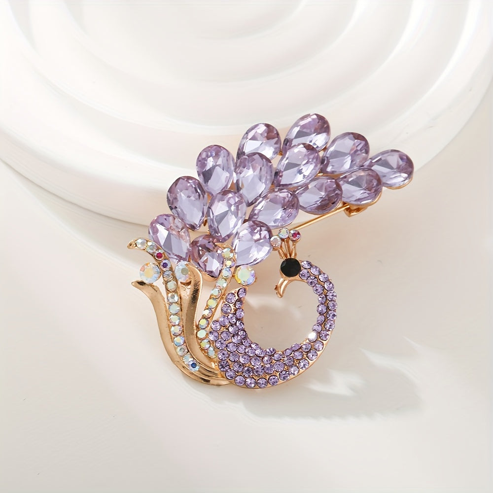 A beautiful purple crystal brooch pin, featuring an elegant and unique design with rhinestones. This fashion accessory is made from high-quality alloy material and showcases a stunning peacock design, perfect for women who appreciate stylish and