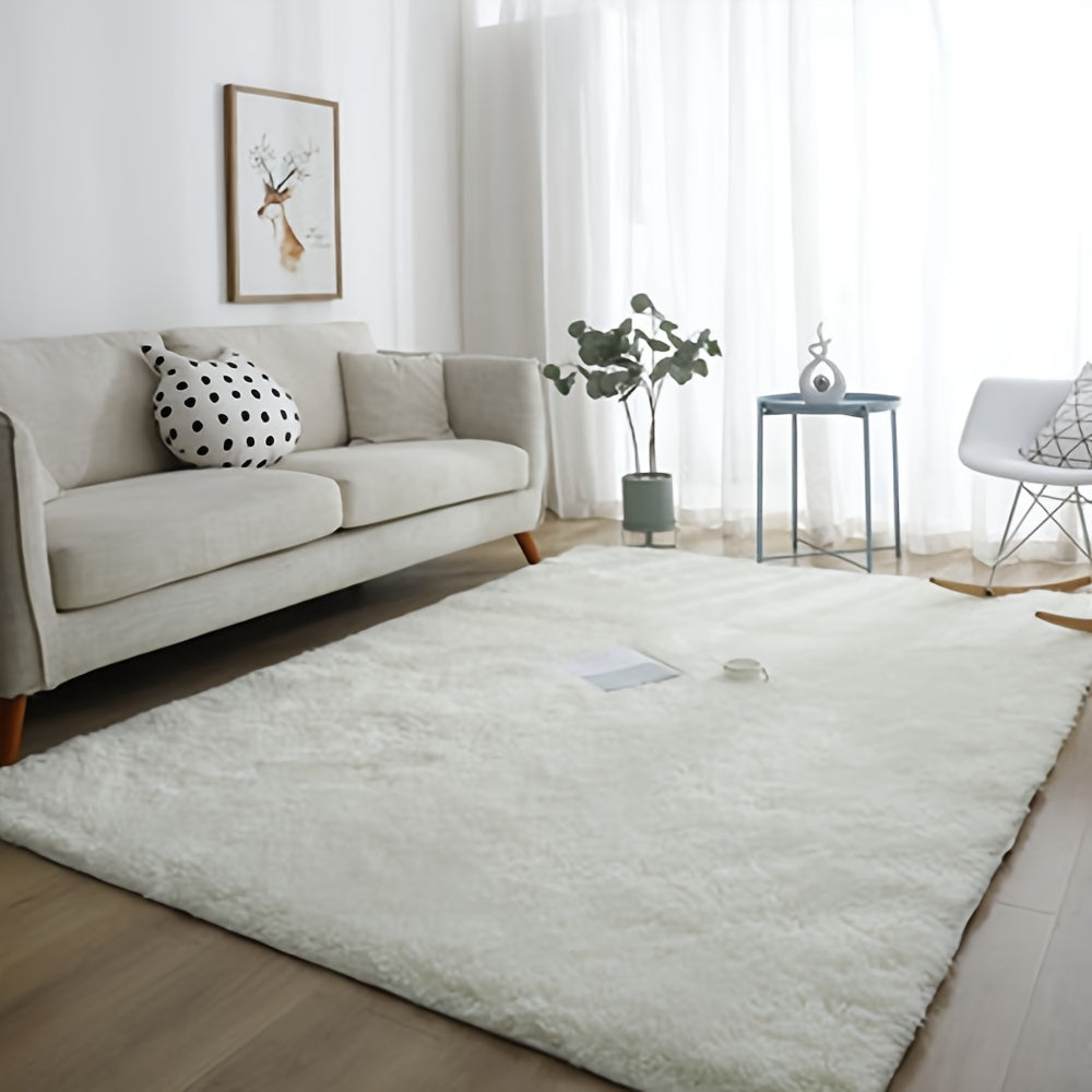 Soft and luxurious pure white plush area rug, ideal for bedroom, living room, and dorm décor. Made from machine washable polyester for easy care.