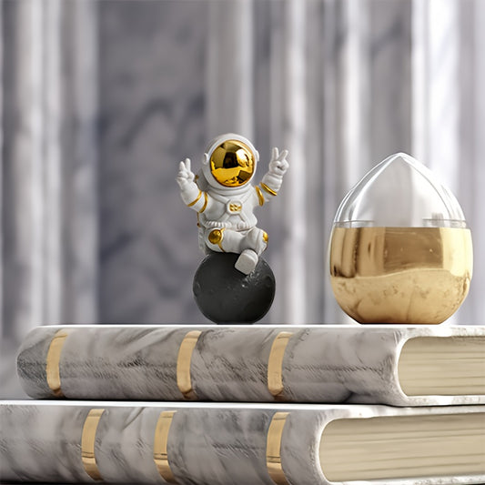 Chic astronaut figurine set with golden egg decor - perfect for home or office; great birthday gift for space enthusiasts.