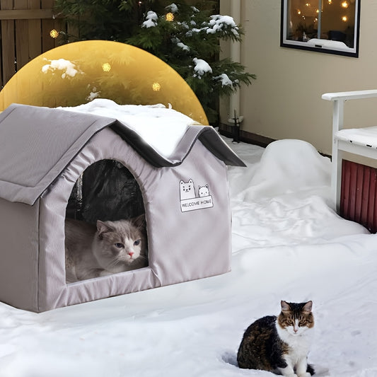 All-weather cat house with removable mat and paw print blanket, perfect for indoor or outdoor use.