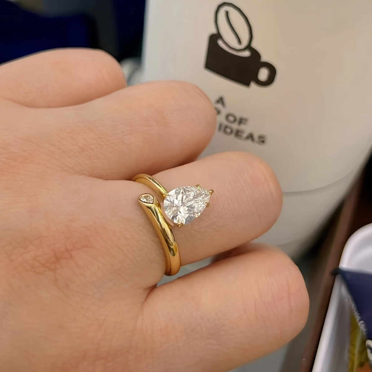 Luxurious 18K Gold Plated 925 Silver Moissanite Engagement Ring featuring a stunning 2 Carat Pear Shaped Gemstone. This Boho Royal Style ring is perfect for an April Birthstone or as a Solitaire Ring for a Wedding or Valentine's Day gift. Comes in a