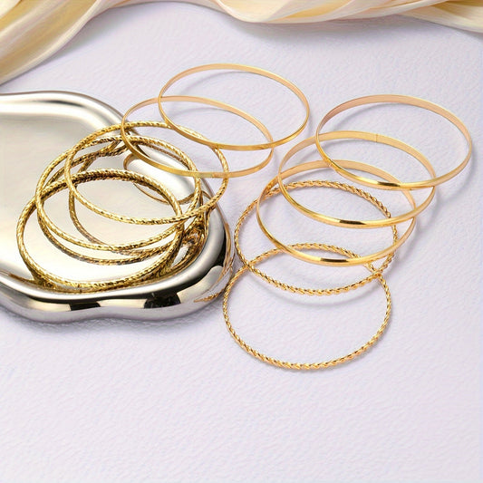 Vintage-inspired fashion bangle set for women, consisting of 12 pieces. Crafted from zinc alloy, these twisted and textured bangles are perfect for daily wear and parties. A versatile accessory that makes an ideal Christmas gift for sisters, girlfriends