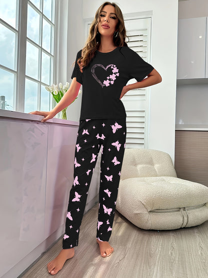 Short-sleeve top and shorts set with hearts, butterflies, and four-leaf clovers pattern, for sleepwear and loungewear.