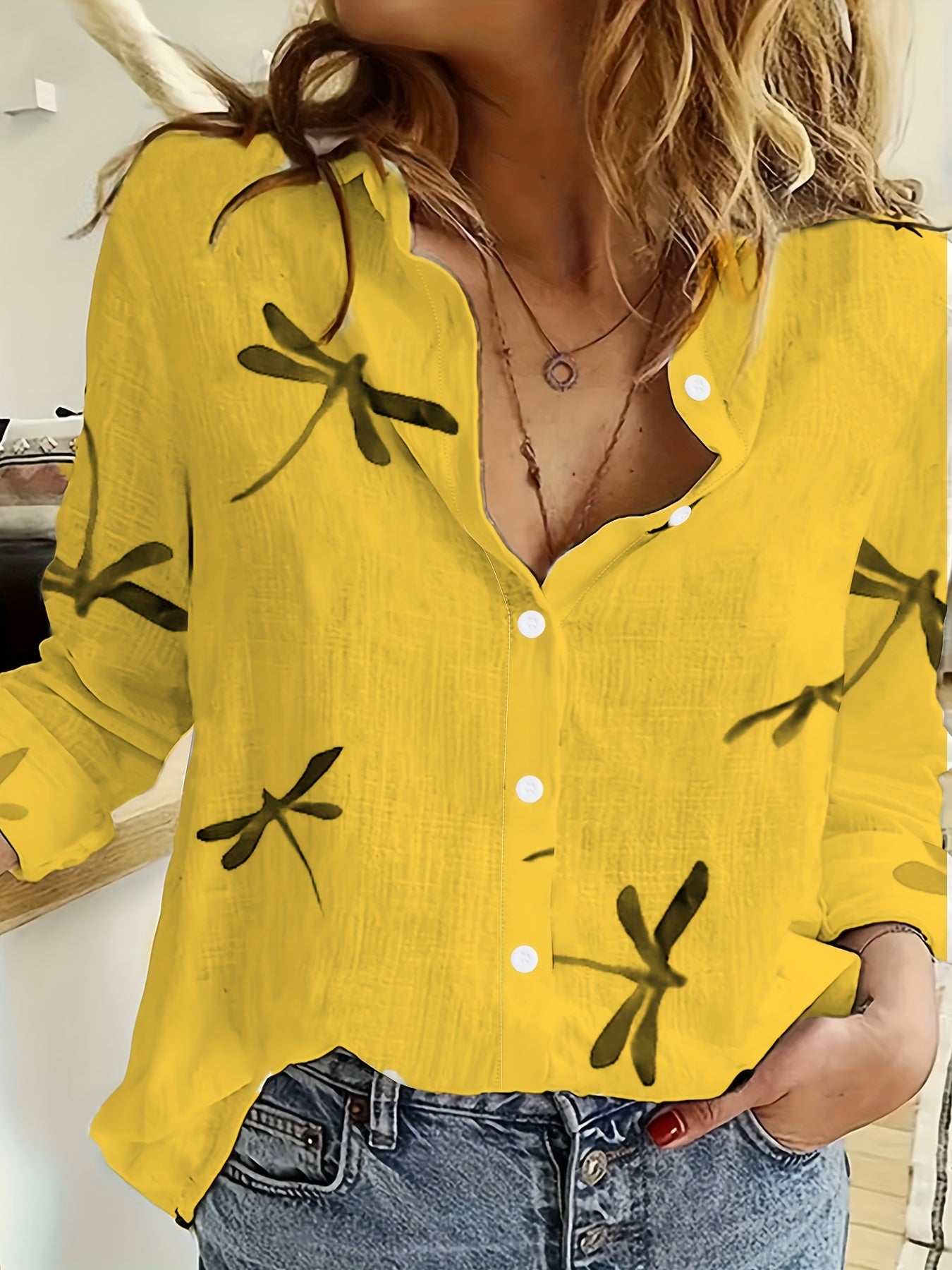 Casual dragonfly print blouse for women made of breathable polyester and spandex, semi-sheer, with long sleeves and lapel collar.