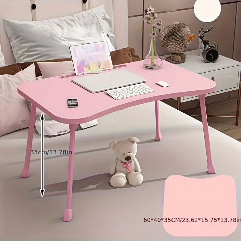 Portable laptop desk that can be used as a bed table, breakfast tray, standing desk, notebook stand, or reading holder for use on the bed, couch, sofa, or floor. Includes a convenient bottle holder and is foldable for easy storage.