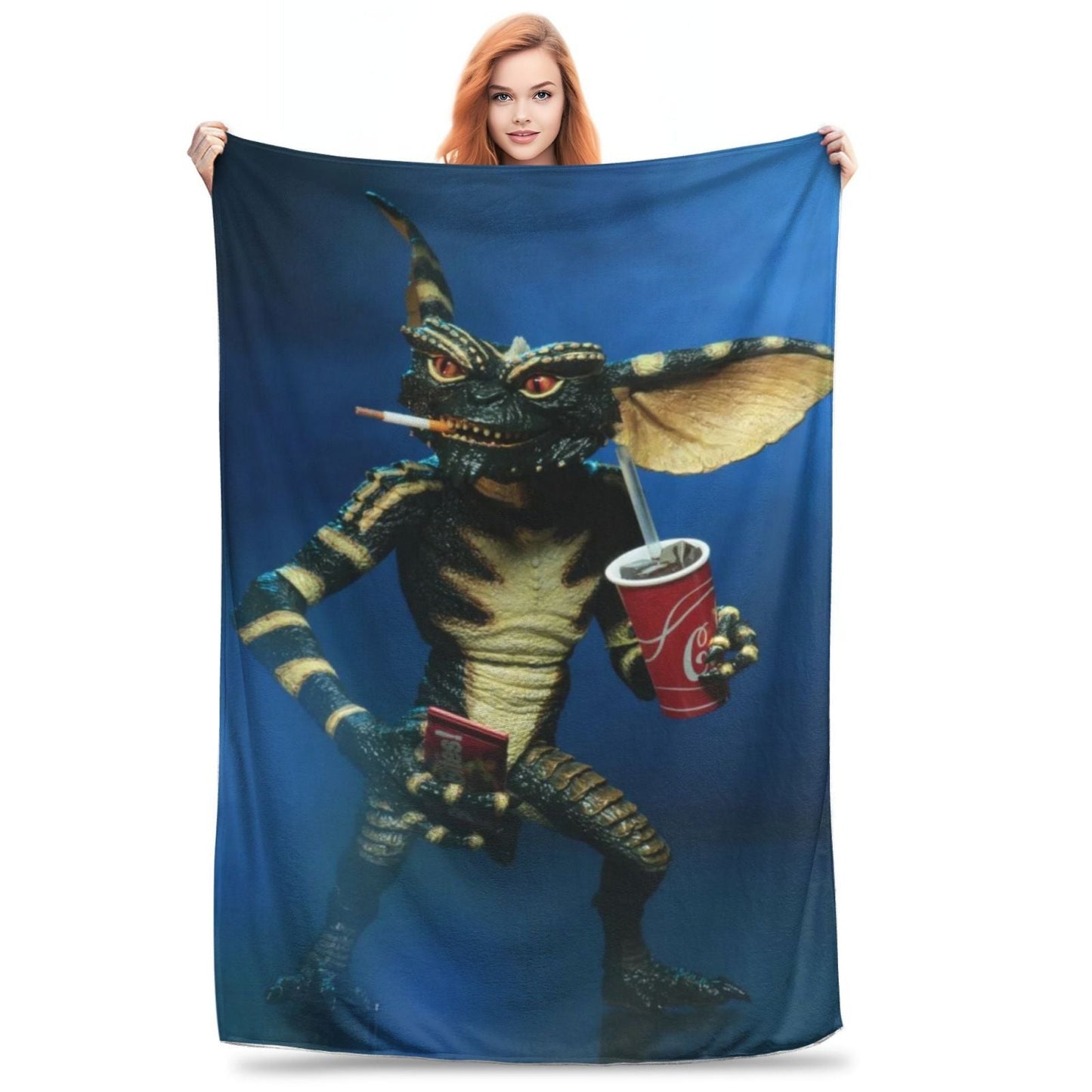 Stay cozy with the Coca-Cola Gnome Print Flannel Fleece Blanket. This modern-style blanket is perfect for adding a touch of whimsy to your sofa or bed. Made from soft and comfortable 100% polyester, this blanket is designed for all-season use. The