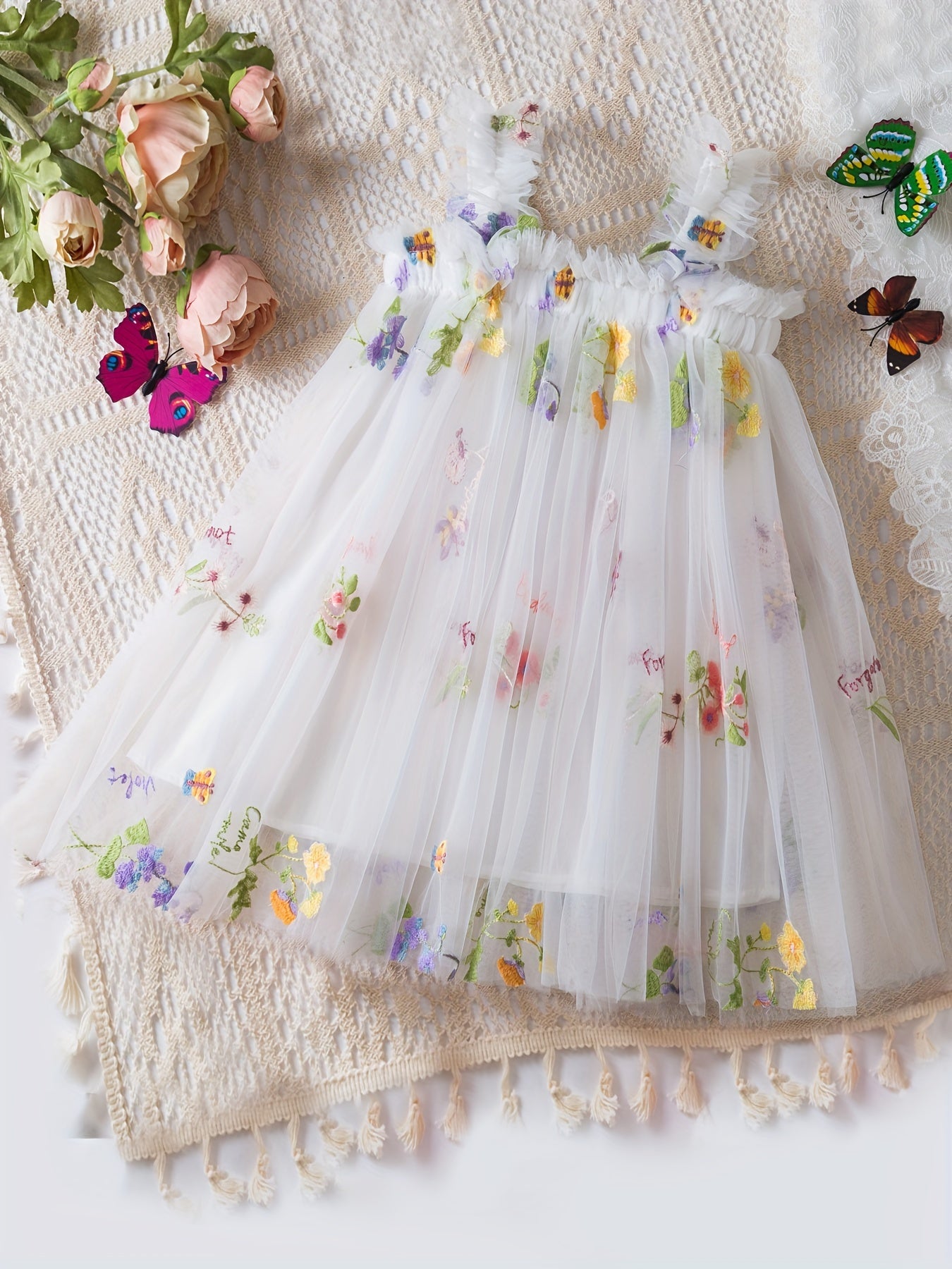 Baby's sleeveless mesh dress with elegant flower embroidery, perfect for summer birthday parties or as a gift.