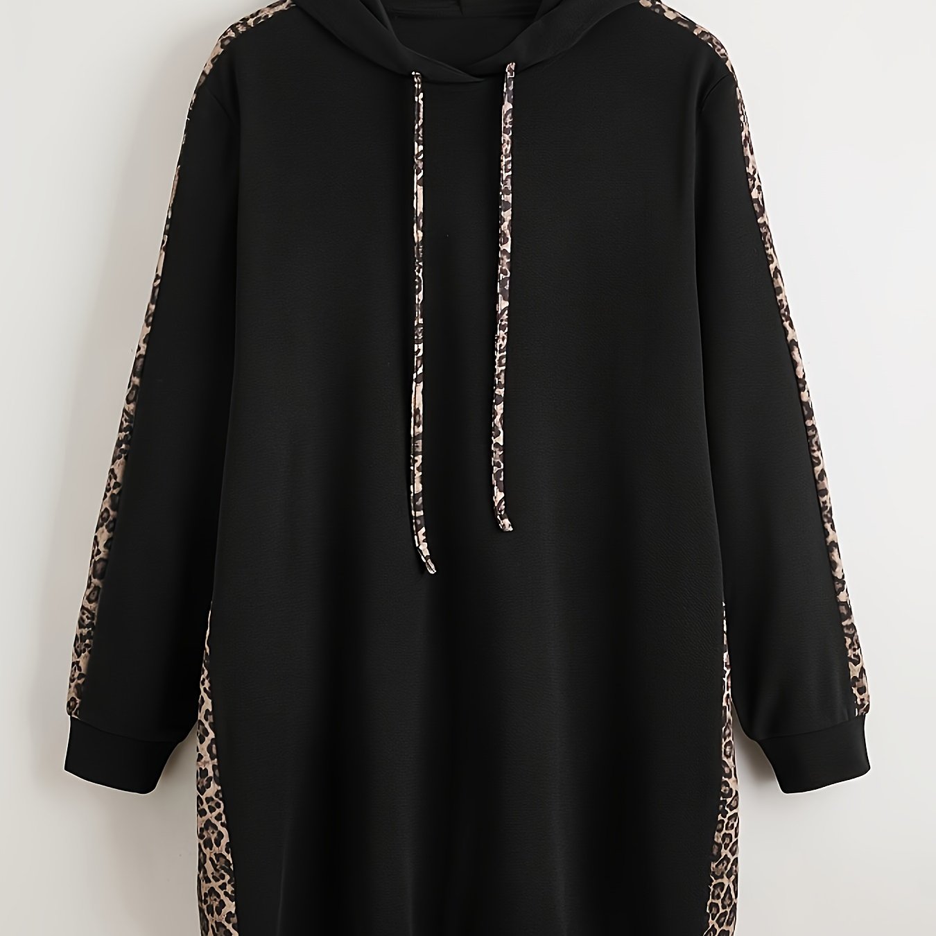 Black hoodie with leopard print accents, long sleeves, drawstring hood, and pockets. Made from polyester knit, oversized fit.