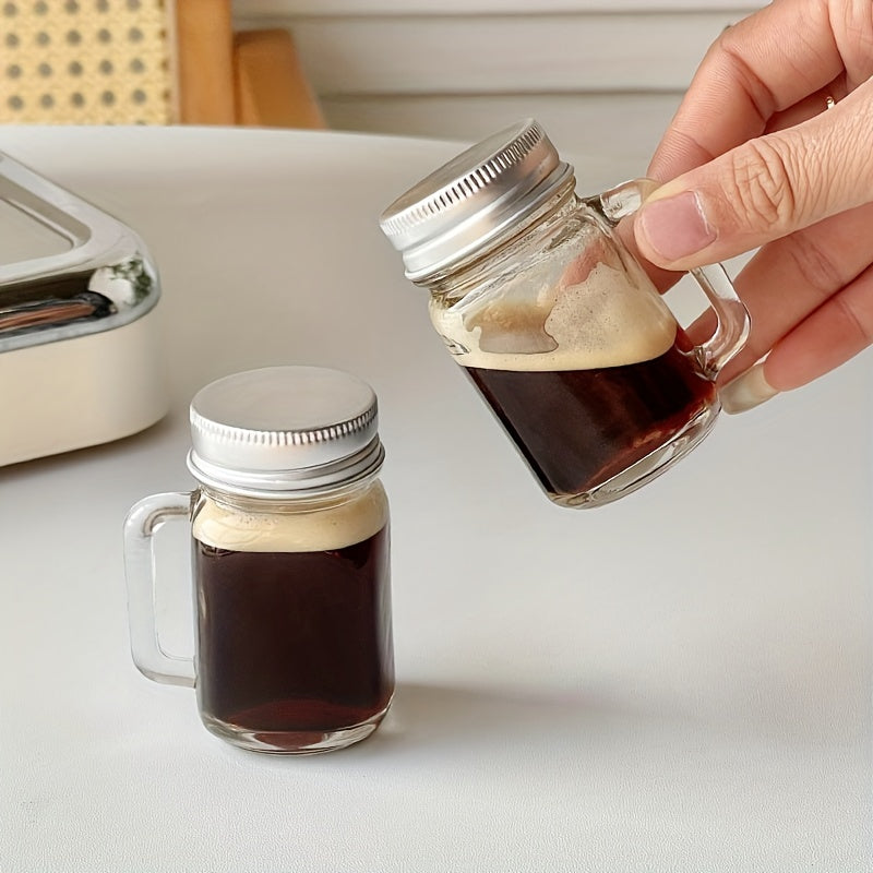 Mini Mason jar shot glass with lid, leakproof glass, ideal for home, parties, and bars. Perfect for beverages such as coffee, milk, juice, honey, and jam. Hand wash only.