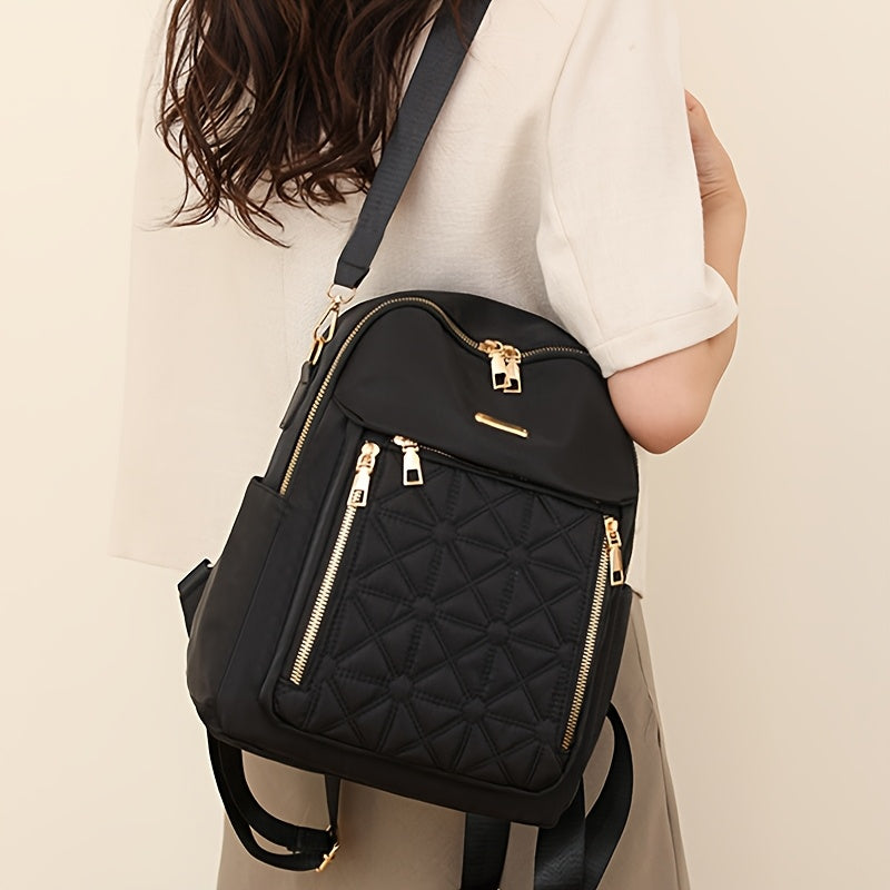 Fashionable nylon backpack with zipper closure and soft shell laptop bag.