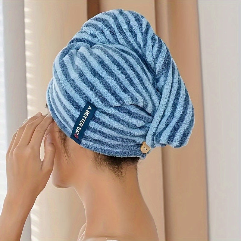 Modern blue and white striped hair towel wrap with button closure. Ultra-soft, absorbent, and low-shedding. Perfect for quick drying in a space-themed bathroom.