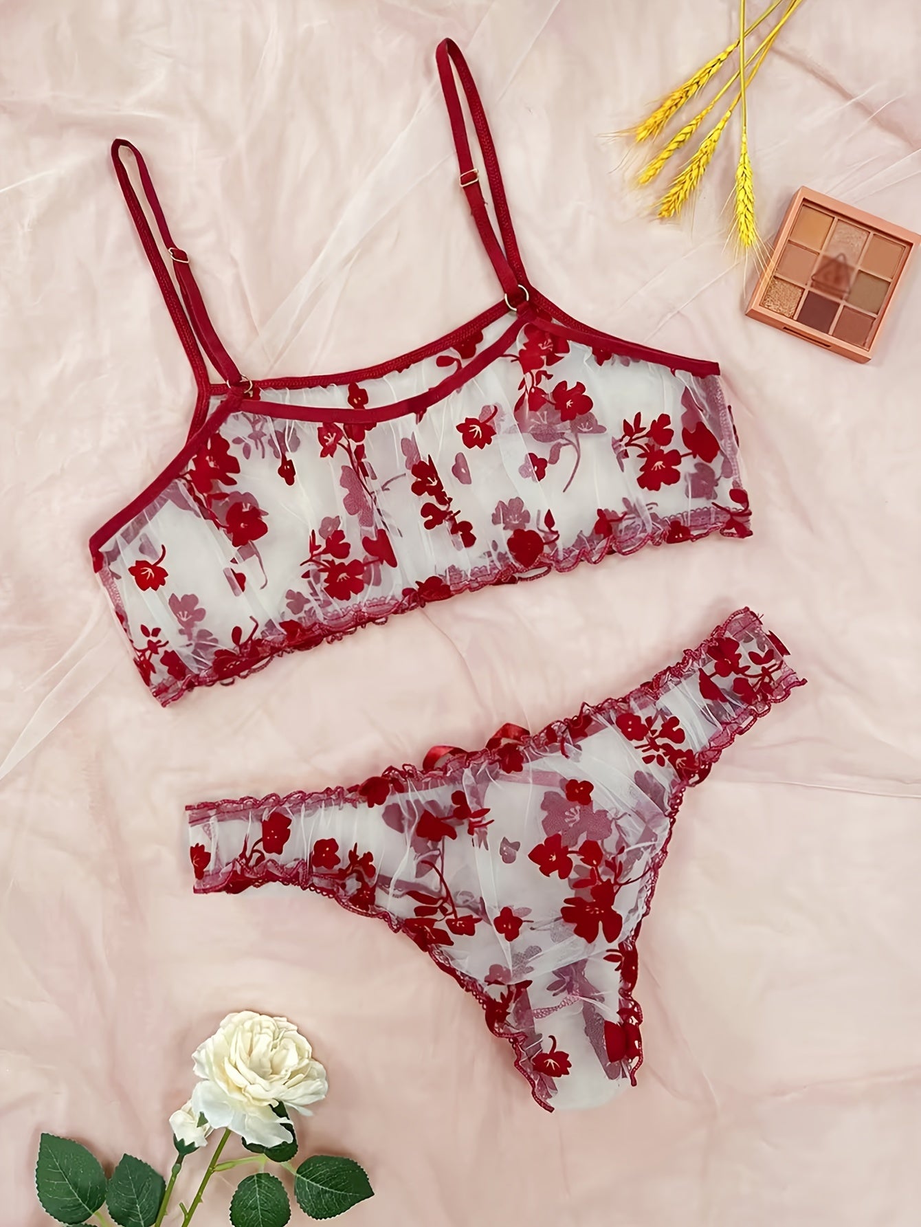 Lingerie set with floral print tulle, see-through bow bra, and tempting thong.