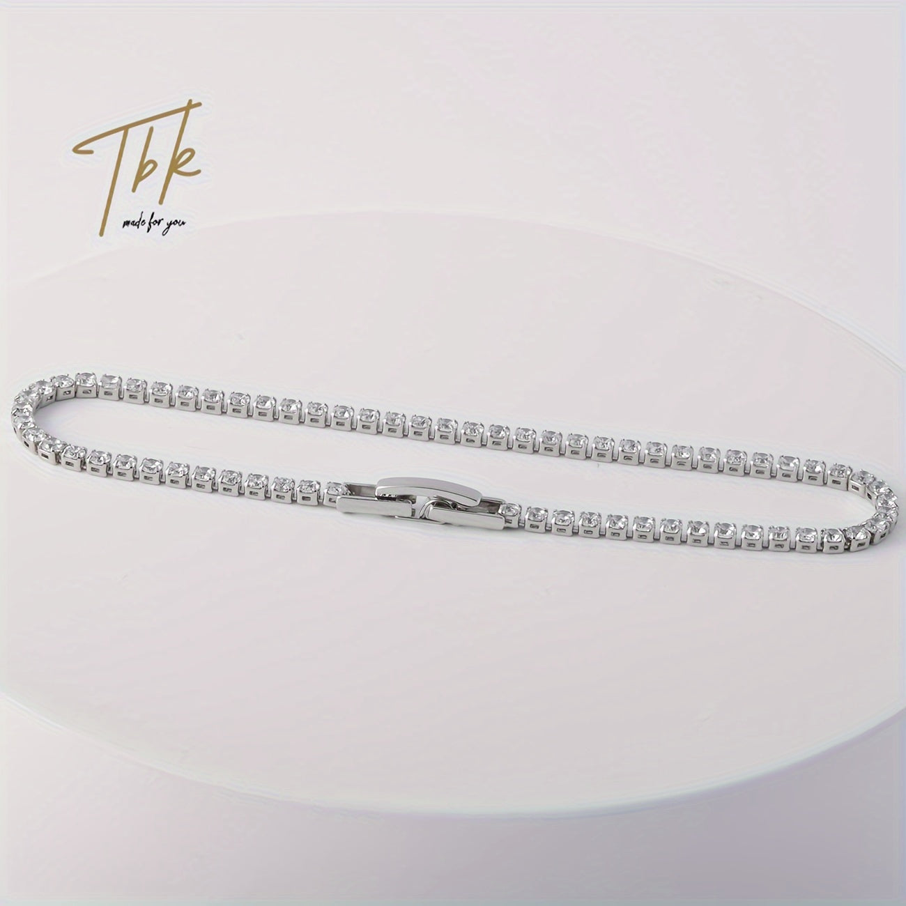 Ice up with this dazzling zirconium-studded tennis bracelet made of shiny titanium steel, presented in a gift box for an extra touch of luxury.