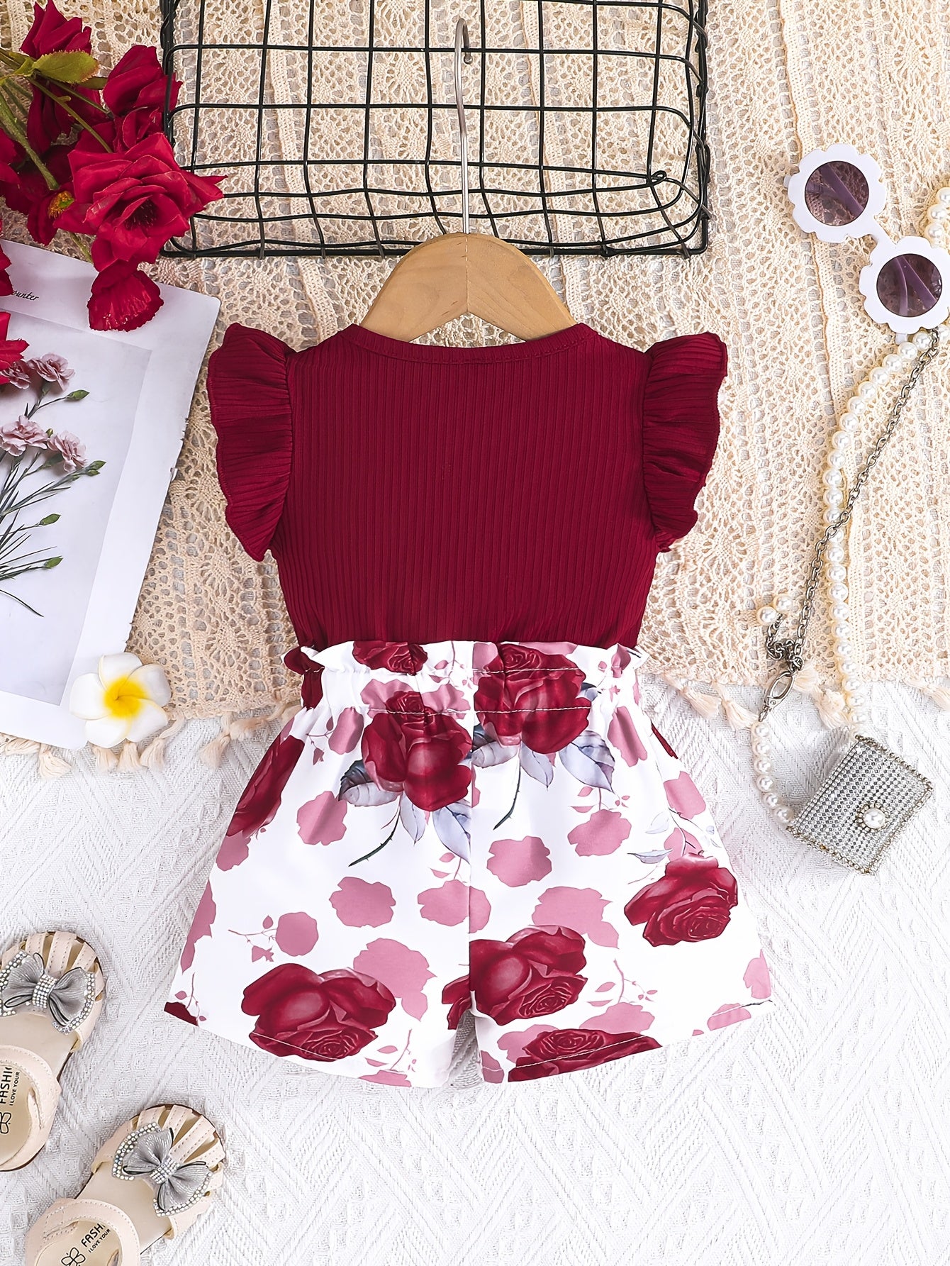 Cute girls' summer outfit: Maroon ribbed T-shirt with bow and floral print shorts set - Made with easy-care polyester blend, machine washable, ideal for outdoor wear.