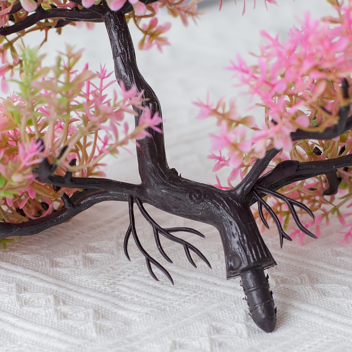 Small plastic bonsai for wholesale with a realistic look, perfect for home decoration.