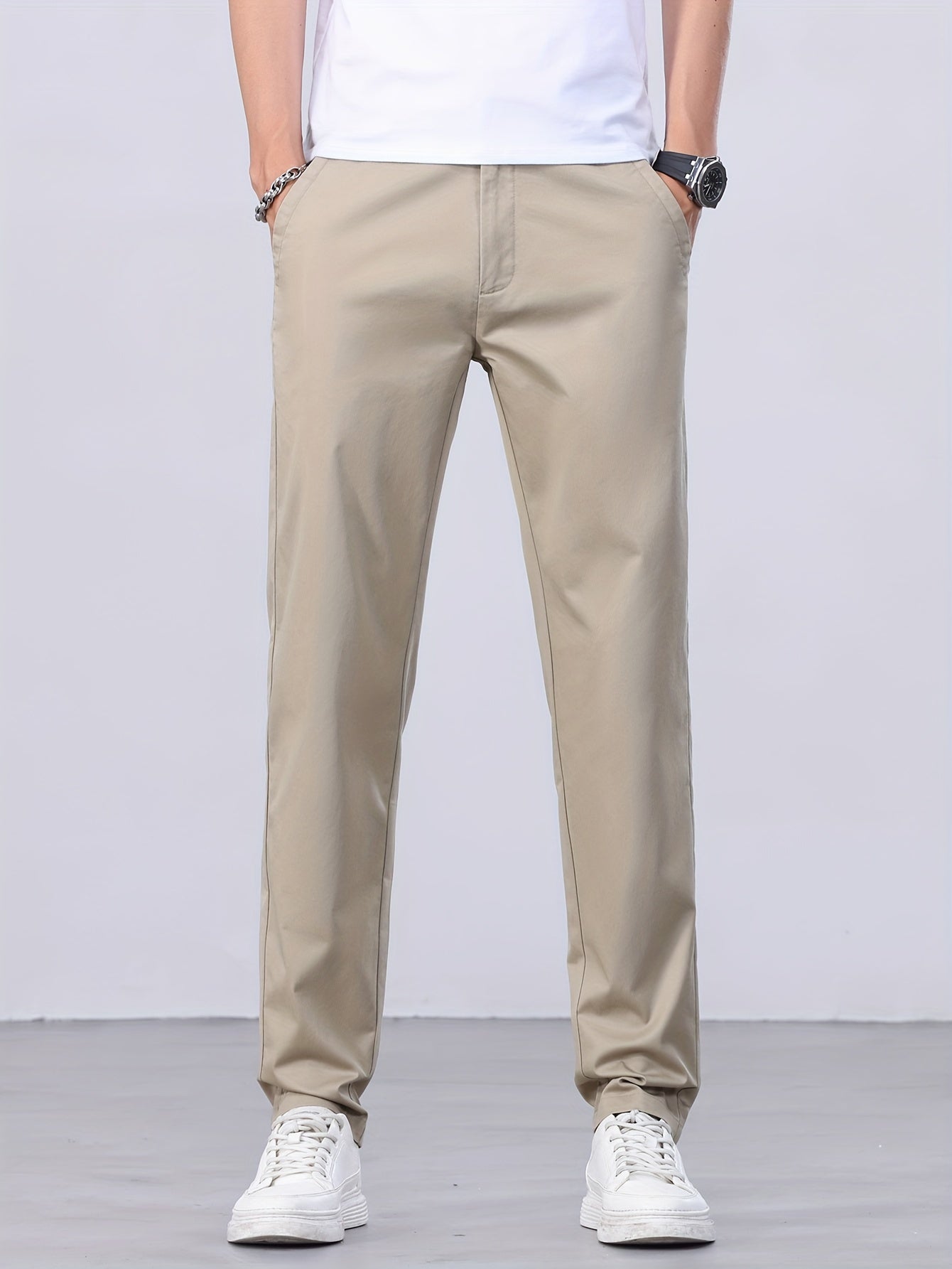 1 Men's all-season casual pants in caramel color, made of cotton blend with slight stretch and regular fit, featuring mid waist, pockets, zipper fly, and woven work style for weekend casual.