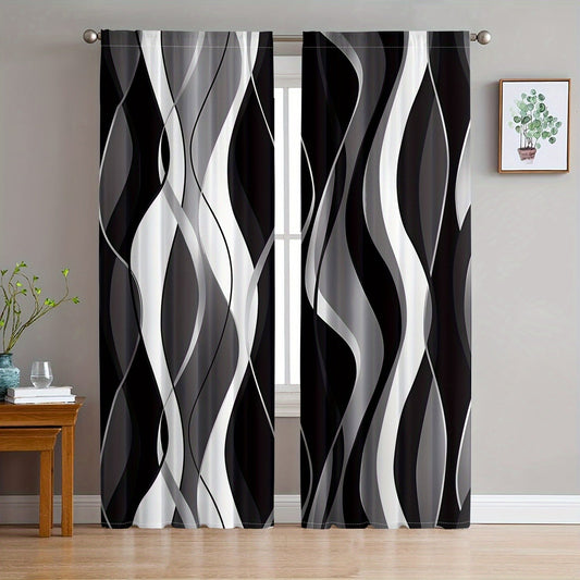 A modern abstract geometric curtain set, featuring 2 pieces in black and white. These semi-transparent privacy drapes are perfect for the living room and bedroom, and are machine washable for easy cleaning.