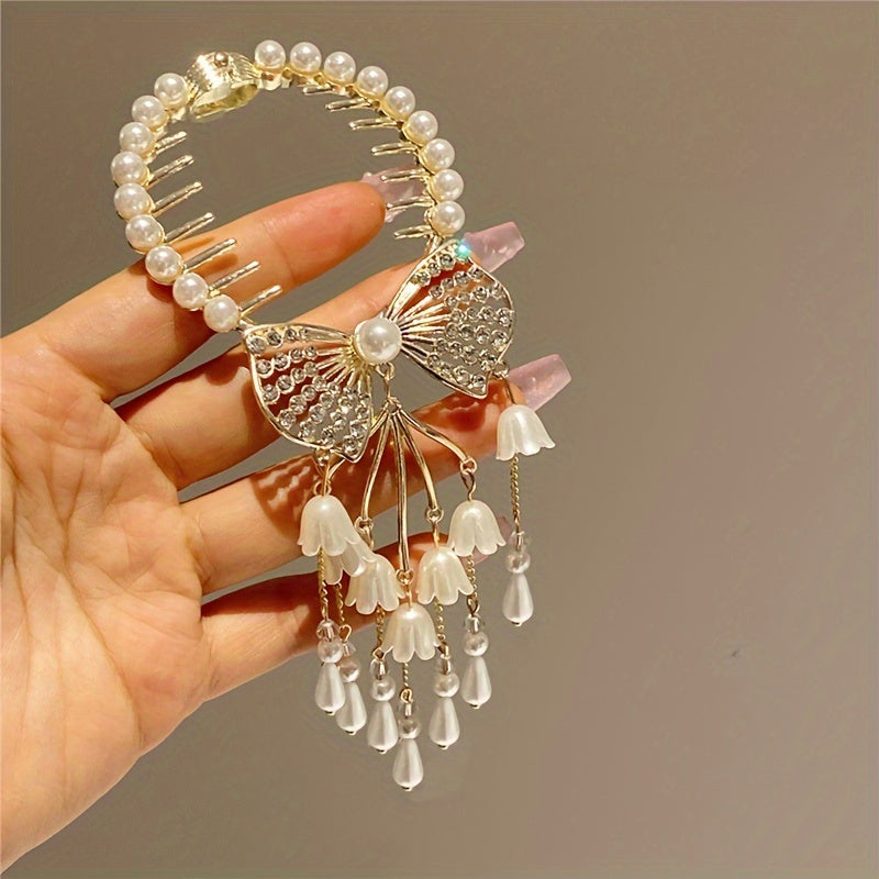 Retro rhinestone and imitation pearl hairpin for bun hairstyles.