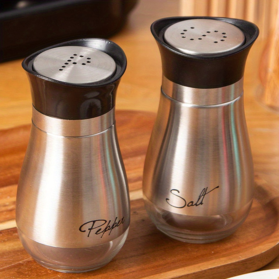 Set of two 3.4oz salt and pepper shakers for kitchen use.