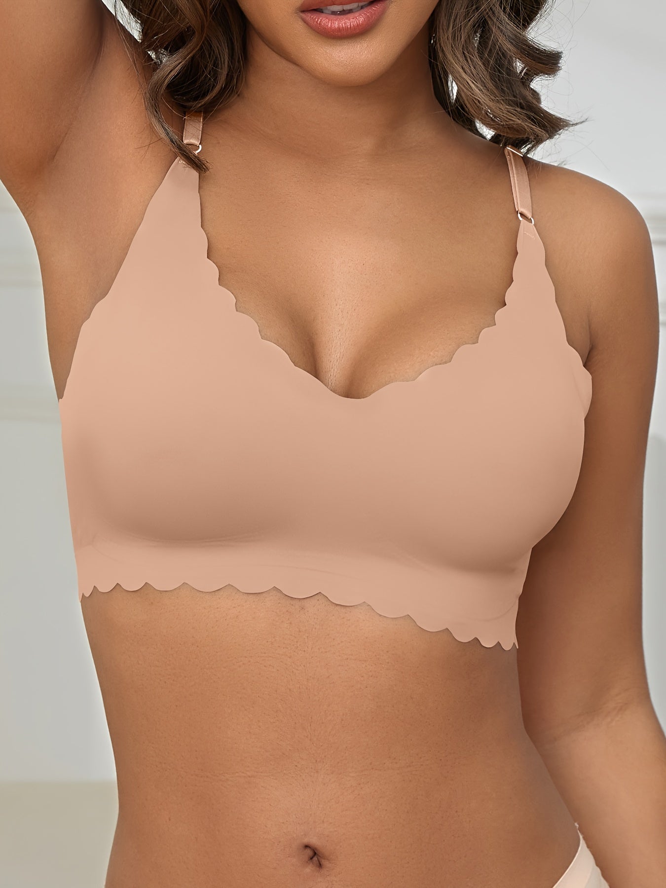 Seamless wireless bra for plus-size women with high elasticity and removable padding, in v-neck solid color.