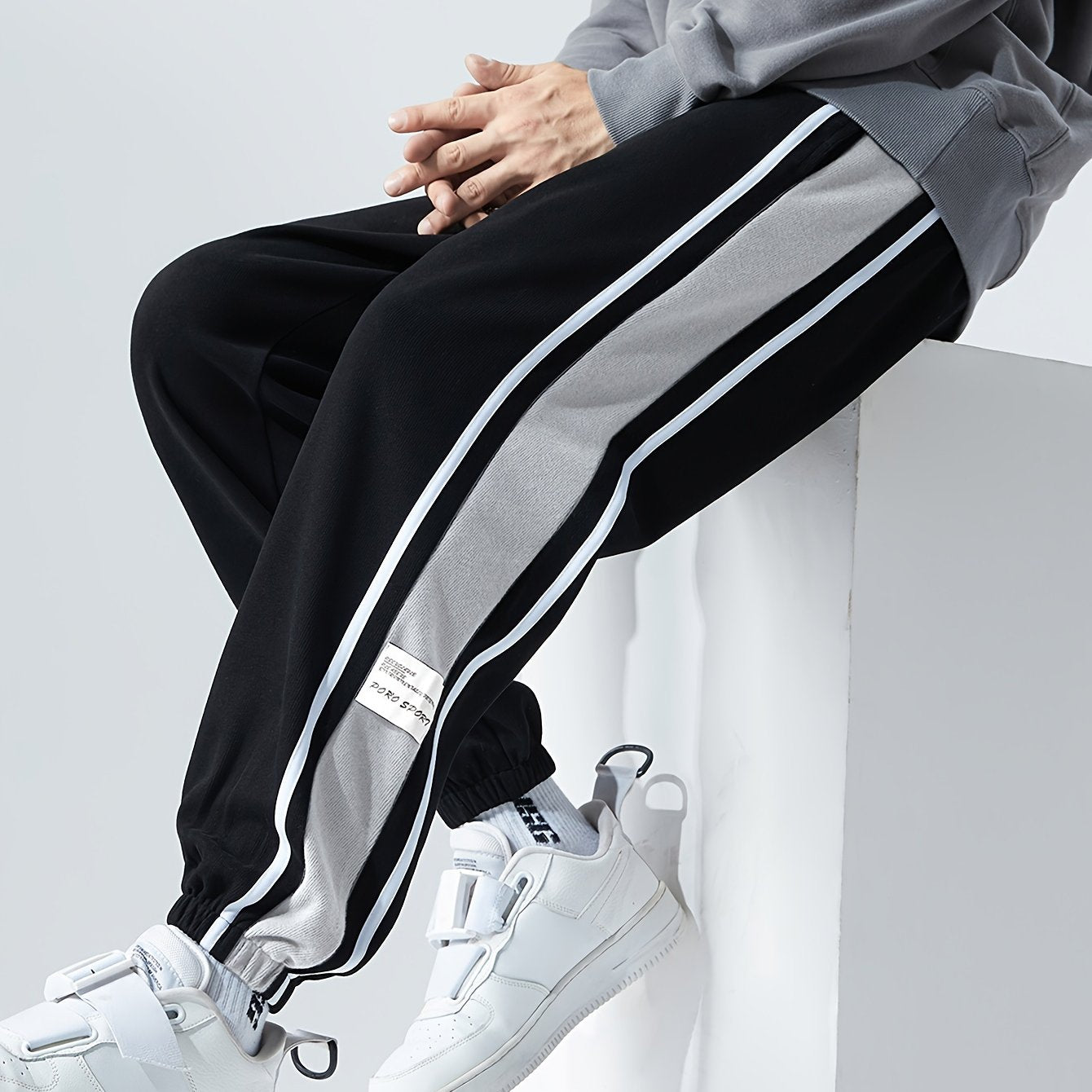 Men's loose sports pants for summer and fall, trendy style, available in large sizes, suitable for casual wear.