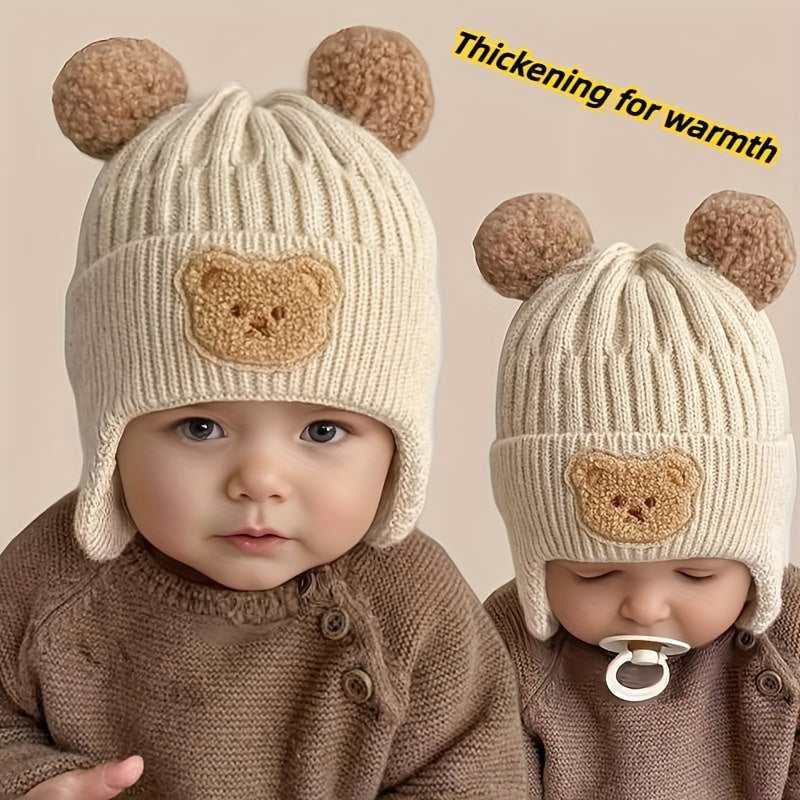 Soft polyester knit hat with cozy bear theme and ear warmers for young children, perfect winter gift for boys and girls aged 0-3 years. Comes in khaki, coffee, and ivory colors.