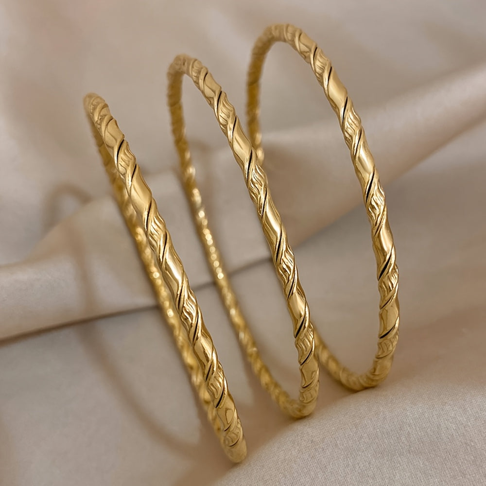 Set of 3 Golden Twist Stainless Steel Bangles, featuring a Chic Classic Tibetan Buddha design. Can be stacked for a stylish look, perfect for both women and men.