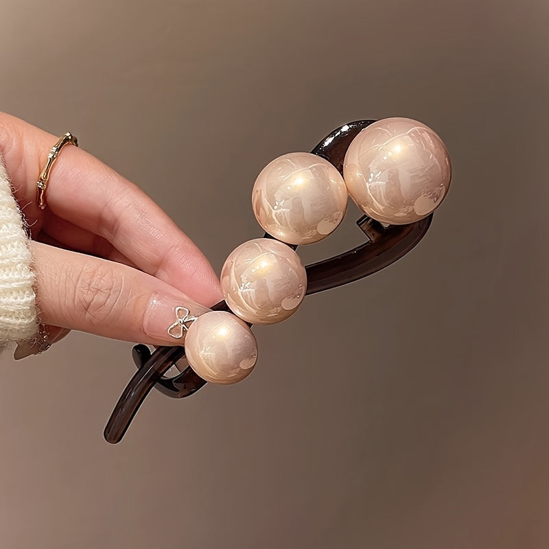 Stylish imitation pearl twist hairpin for daily wear and styling.