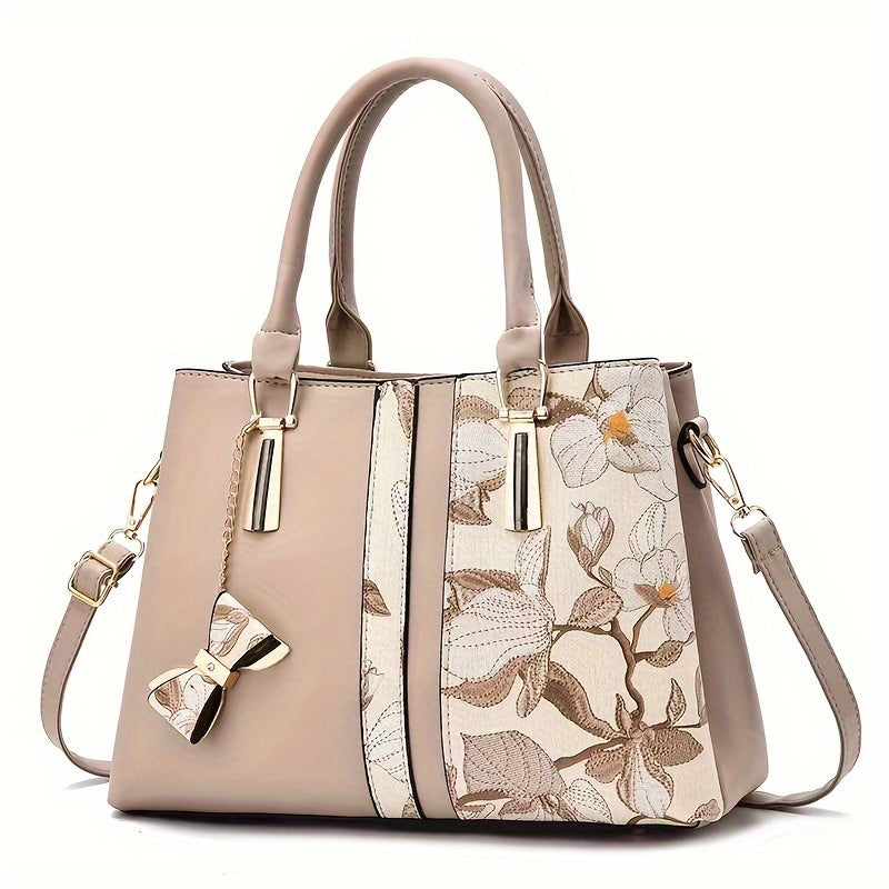 Chic floral print handbag with a spacious crossbody design.