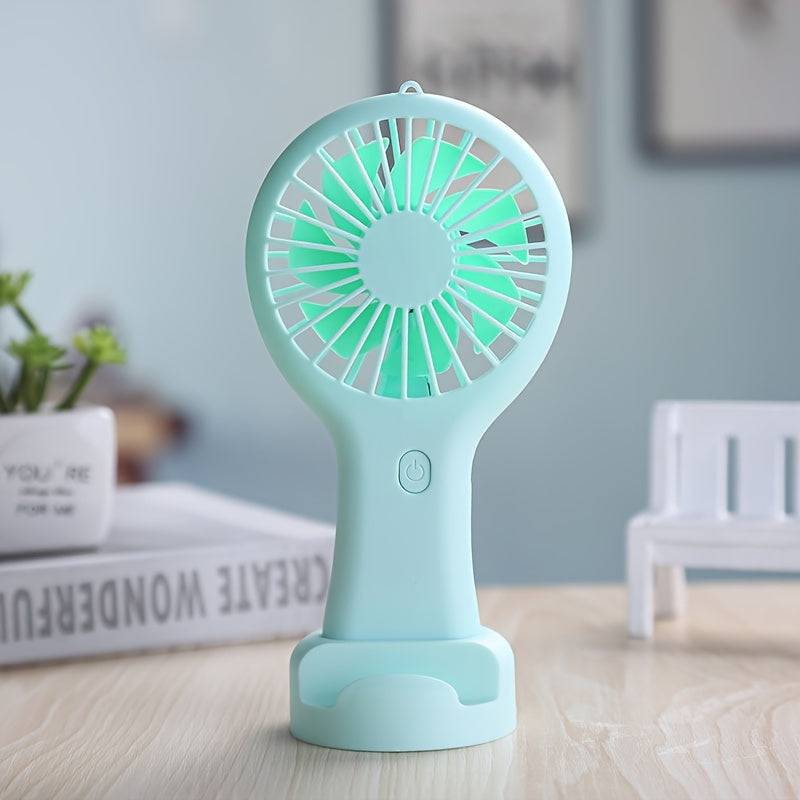 Compact and wearable mini fan for travel, office, outdoor, and home use. This handheld fan is portable, USB rechargeable, and includes a 400mAh lithium battery.