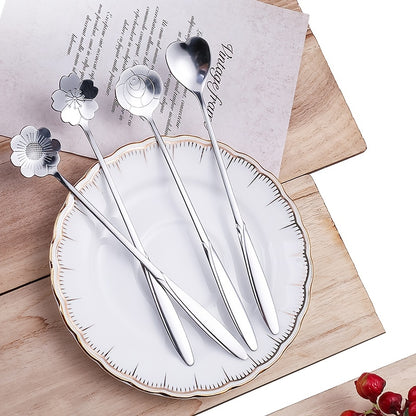 Four stainless steel cherry blossom coffee/dessert spoons.