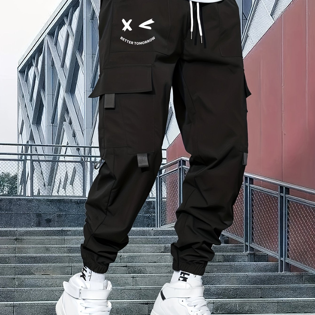 Stylish cargo pants with multiple pockets for men, featuring a loose fit and drawstring waistband for a casual outdoor streetwear look.