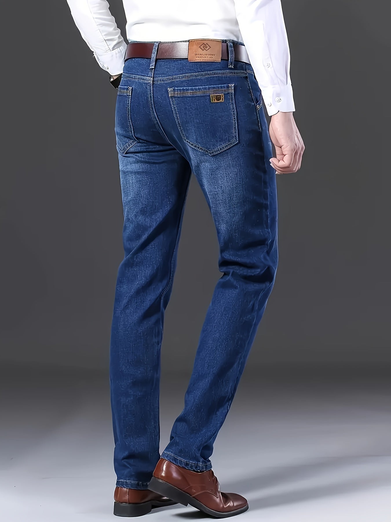 By 2025, the new selection of men's mid-rise cotton stretch straight-fit business jeans features a zipper and button closure.