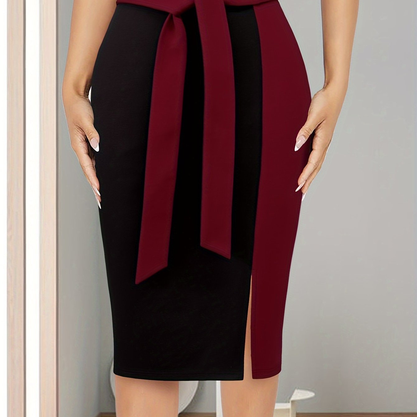 Stylish Color Block Tie-Waist Midi Skirt made of stretchy rayon blend with maroon & black design. Suitable for office or casual wear in spring/summer. Machine washable and comfortable fit.