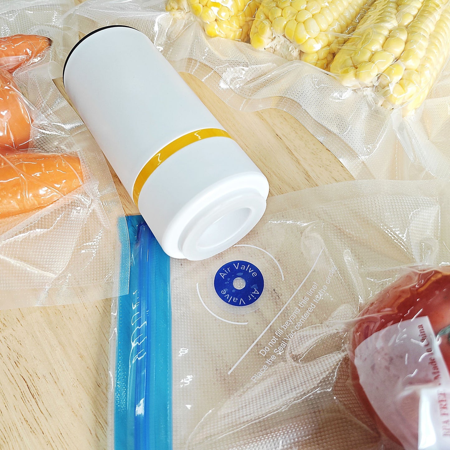 Get the Portable Vacuum Sealer Electric Pump with 5 Reusable Bags - Perfect for Food Storage, Meal Prep, and Sous Vide. This compact machine helps you save food and money. Fits pre-cut seal bags with its universal design. Bags and sealer sold separately.