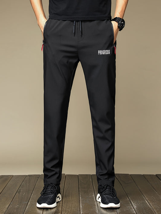 Men's casual long pants made from 100% polyester with a print design. Designed for comfort with breathable and quick-dry fabric. Features zipper pockets and a regular fit. Suitable for