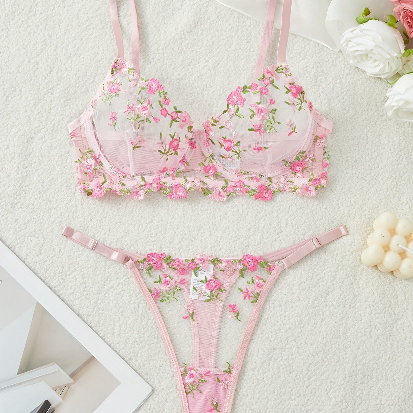 Floral embroidered lingerie set with semi-sheer mesh bra and thong for women.