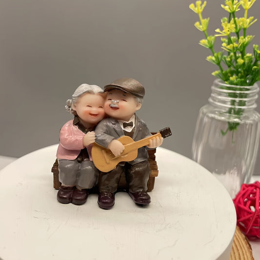 Resin figurine of charming elderly couple, ideal for home or office decor. Perfect Valentine's Day or anniversary gift.