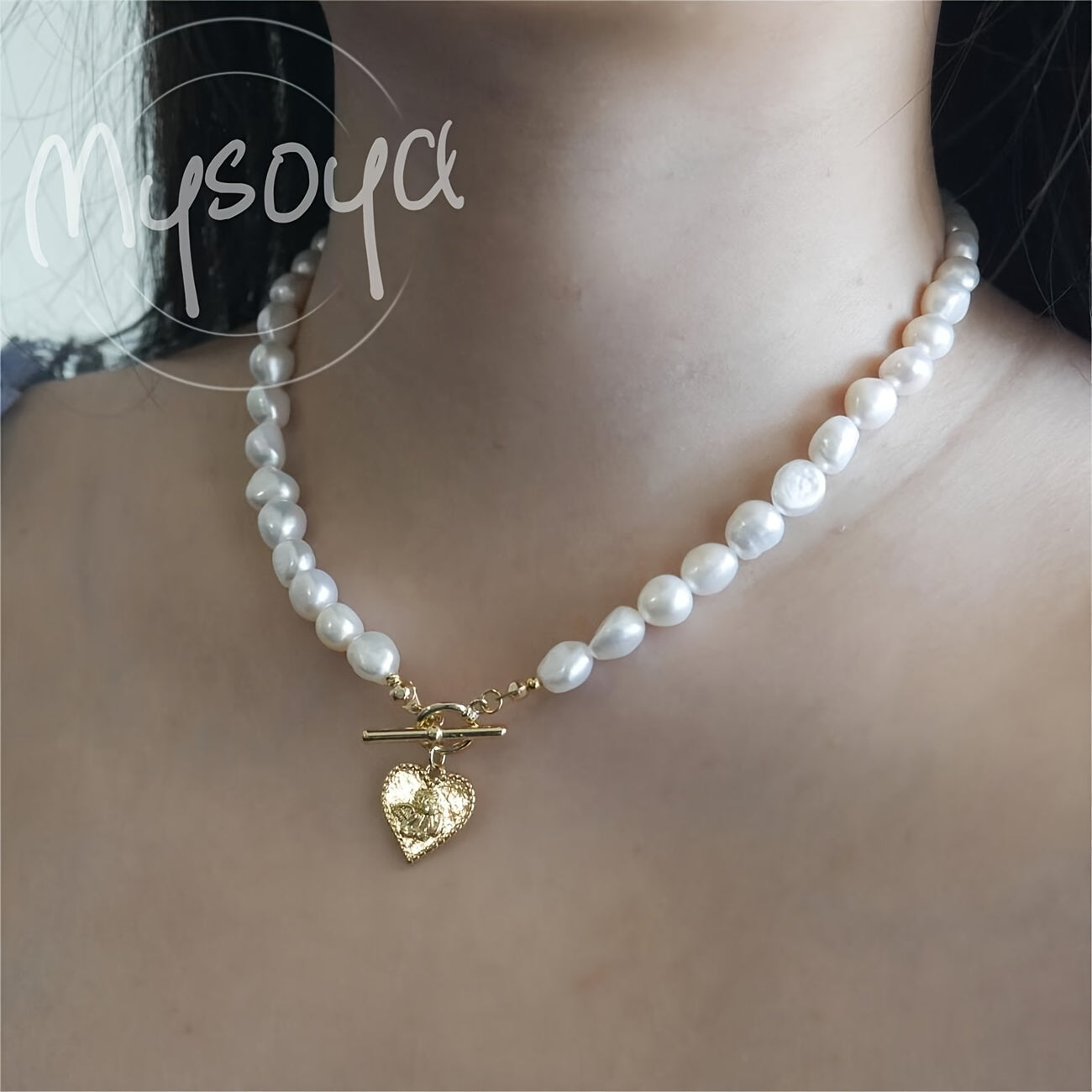 This elegant necklace features a handcrafted Baroque freshwater pearl with a golden heart pendant. Measuring 7-8mm, it comes in a beautiful gift box, making it a perfect gift for birthdays, anniversaries, Valentine's Day, and any special occasion.