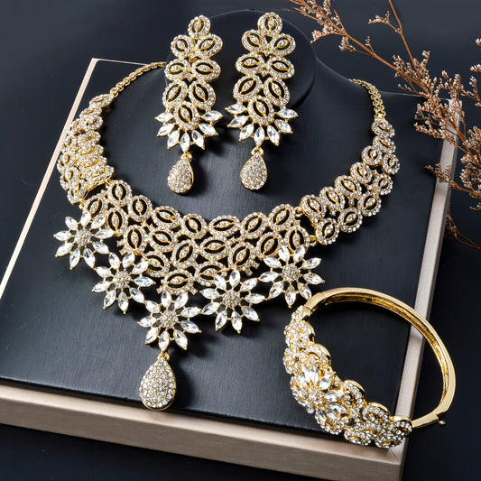 Indulge in the opulence of the ZEADEAR Luxurious and Elegant Jewelry Set, complete with a stunning necklace, bracelet, ring, and pair of earrings. Adorned with sparkling Zirstone flowers and a dripping pendant, this set is ideal for romantic weddings and