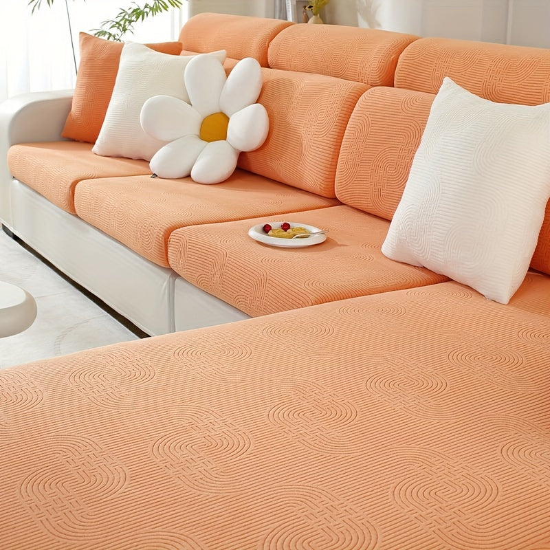 Jacquard sofa slipcover with universal fit and elastic design for furniture protection and home decor in any room.